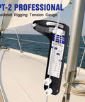 Rugged Sailboat Rigging Tension Gauge With Pro Grade Analog Dial 2000 Lb Max Load mounted on sailboat mast, sea view