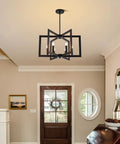 Killer 22 Inch Black Chandelier With Six Geometric Farmhouse Lights, Modern Industrial Pendant Fixture Over Kitchen Island Or Dining Room, Swoon Worthy Entryway Ceiling Lamp in a home's entryway.