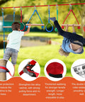 Kids playing on 60ft Slackline Obstacle Course For Kids With 8 Accessories, Tree Protector And Carry Bag in a backyard setting