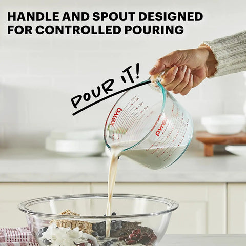 Two Piece Glass Measuring Cups Set With 1 Cup And 2 Cup Sizes, in use pouring liquid into bowl