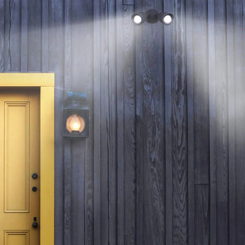 Outdoor Security Flood Light Dual Head 20W LED Bullet Style Flood Light 1900 Lumens IP65 mounted on wall by yellow door