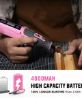 Close up of Pink 4V Cordless Rotary Tool Kit With Seventy Heavy Duty Bits And Slick Engraving Handle used for wood cutting.