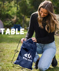 Person holding a portable Inflatable Couch Air Lounger Chair No Pump Needed For Camping And Beach Trips in a 2.6 lb bag outdoors