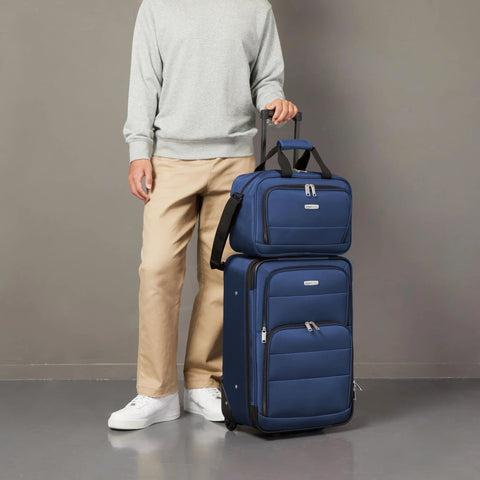 Amazon Basics navy blue 2-piece softside luggage set, front view with 23-inch expandable suitcase on wheels and 15-inch tote.