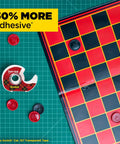 Super Hold Tape With 50 Percent More Adhesive, Clear Finish, 2 Rolls, Dispenser Ready next to checkers board on green grid mat