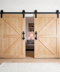 Dope Industrial Pipe Barn Door Handle Set In Rustic Black Iron, 12 Inch, installed on light wood sliding doors