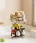 Two Tier Clear Rotating Vanity Organizer With Smooth 360 Degree Spin For Skincare And Perfume Beauty Essentials Storage Hits Different On Your Bathroom Counter Or Dresser Shelf Making Your Glow Up Setup A Total Game Changer with jars and bottles.