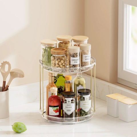 Two Tier Clear Rotating Vanity Organizer With Smooth 360 Degree Spin For Skincare And Perfume Beauty Essentials Storage Hits Different On Your Bathroom Counter Or Dresser Shelf Making Your Glow Up Setup A Total Game Changer with jars and bottles.