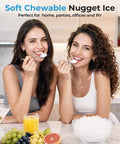 Two women enjoying soft chewable nugget ice from the Slick Countertop Nugget Ice Maker With Self Dispensing Tray Drops Thirty Three Pounds Of Fresh Chewy Ice Daily Ready In Ten Minutes For Every Home Bar Or Big Bash.