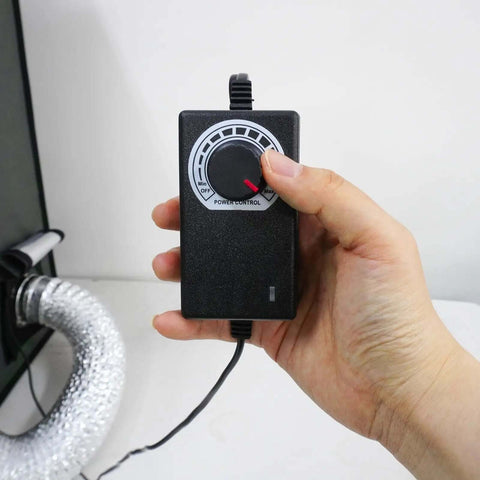 Hand adjusting control knob on Printer Enclosure With Ventilation Filter And Speed Control 12V Fan 5000RPM for resin 3D printing