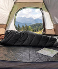 Cozy Yet Lightweight 3-4 Season Sleeping Bag For Adults And Kids, 4-Pound Packable With Compression Sack in a tent.