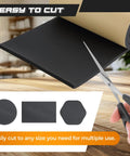 Scissors cutting into Adhesive Neoprene Foam Sheet One Half Inch Thick 12 Inch Wide 54 Inch Long For DIY Gaskets And Crafts