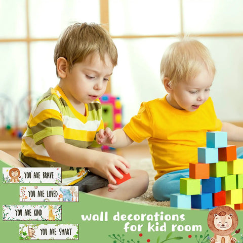 Two young children playing with blocks in a room with 4 Piece Baby Nursery Wall Art Set Unframed Woodland Animal Prints on walls.