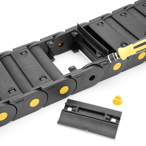 Close-up of R55 25mm By 77mm Plastic Cable Drag Chain Wire Carrier with Openable Cover, showing open section and screwdriver