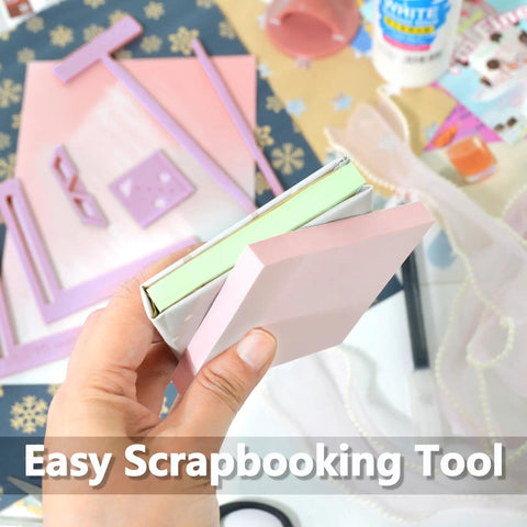 Hand holding six piece bookbinding and scrapbooking tool kit with durable plastic templates for starters.