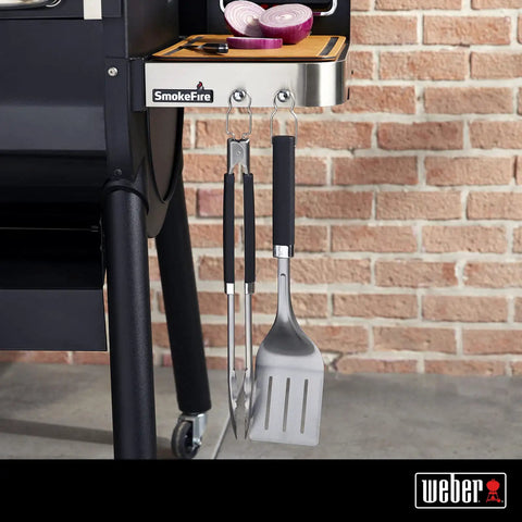 Precision Tongs And Spatula Grilling Tool Set With Hands Free Locking Tongs, 3 Sided Beveled Spatula hanging on grill