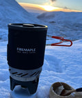 Fixed Star 1 Backpacking Stove System With Propane Cooking Gear on snow with sunset view