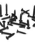 Premium Grade Six Gauge X One Inch Black Wood Screws 120 Piece Pack Carbon Steel Construction Rust Resistant Fasteners scattered on white surface.