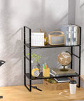 Expandable Cabinet Storage Shelf Organizer Heavy Duty Steel Space Saver For Kitchen Pantry Counter Desk Office And Garage Adjustable Height Black 1 Pack displaying books and decor.