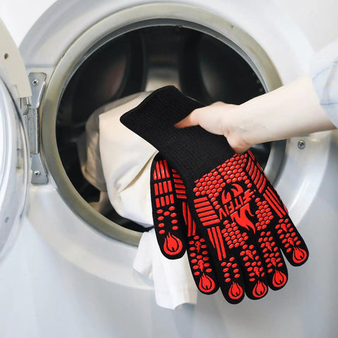 Extreme Heat Resistant BBQ Gloves For Grilling And Baking Up To 1472F Silicone Non Slip Oven Mitts being washed