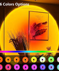 Sunset Lamp With 16 Color Modes And Remote Control Lit Night Light casting orange glow on wall decor in living room
