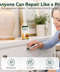 Slick White Wood Filler Sticks 4 Pack Putty for Furniture and Floor Repair used by a woman to fix scratches on a white cabinet.