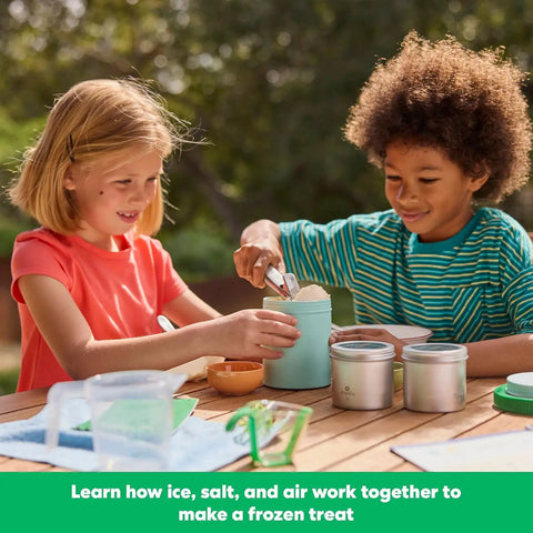 Children using Science Of Cooking Ice Cream Kit For Kids: DIY Hands On Kitchen Chemistry Project outdoors on a table.
