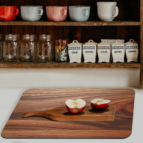 Natural Brown Rustic Wood Grain Dish Drying Mats Two Pack Absorbent Non Slip Kitchen Counter Mats For Coffee Machines And Small Appliances Heat Resistant Pad Cut To Fit 12 By 20 Inches with apple slices on a cutting board in a kitchen setting.