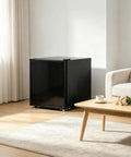 Slick Compact Upright Mini Freezer Offering One Point One Cubic Feet Of Cold Storage With Five Adjustable Thermostat Settings And A Reversible Black Exterior For Storing Meats Seafood And Desserts Without The Sweat in a modern living room.