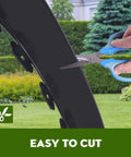 Landscape Edging Kit 33 Foot Roll 4 Inch Plastic Garden Edging With 100 Spikes for lawns being cut with scissors