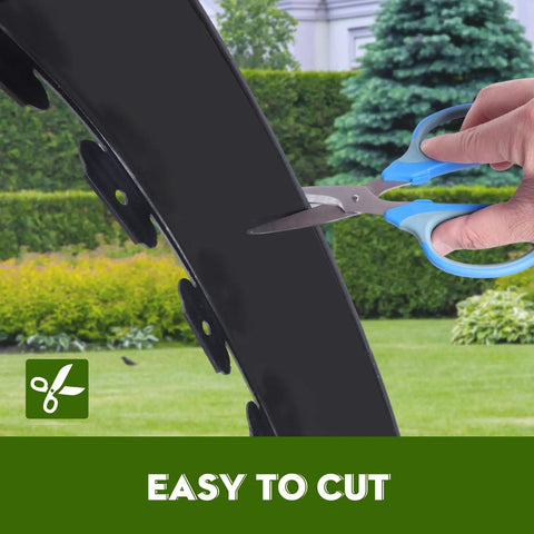 Landscape Edging Kit 33 Foot Roll 4 Inch Plastic Garden Edging With 100 Spikes for lawns being cut with scissors