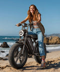 Woman on Beast Of An Adult Electric Bike With 1500W Peak Motor 20 Inch Fat Tire All Terrain E Bike on a beach