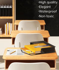 Black Transparent Expanding File Folder 7 Pack With Snap Closure No Dividers Large Capacity 13 By 9.8 Inch on a desk.