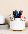 360 Degree Rotating Pen Holder With Five Slots displaying pens and scissors on a desk.