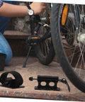 Close-up of Sturdy Aluminum Roof Rack Bike Carrier Mount With Quick Release Fork Bracket being installed on beefy mountain bike