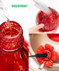 34 Oz Hand Blown Glass Hummingbird Feeder with Ant Moat, showing close-up of leakproof metal base and safe copper ports.