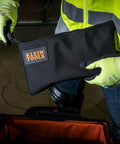 Cordura Nylon Tool Pouch With Heavy Duty Zipper, 12-1/2 Inch Black Zipper Bag held by person in neon safety gear