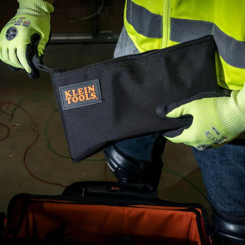 Cordura Nylon Tool Pouch With Heavy Duty Zipper, 12-1/2 Inch Black Zipper Bag held by person in neon safety gear