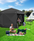 Pop Up Gazebo 15 By 15 Foot Canopy Tent With Sidewalls Screened In For Outdoor Parties And Camping, Easy No Tool Setup, Portable Backyard Shelter, Fits 12 To 15 People, Black installed on grass with people inside and picnic setup outside.