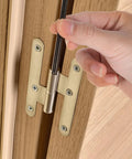 Close-up of hand installing a Black Door Hinge Pin 3.5 Inch Replacement on a wooden door, showing pin placement for smooth door operation.