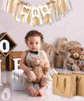 Kraft Paper Gift Bags Set Of 20 For Birthday Bashes And Weddings, beside a child with teddy bears and "one" banner decor
