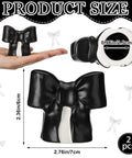 Black Coquette Bow Toilet Bolt Covers Set Of Two - Durable Ceramic Screw Nut Caps For Bathrooms - Cute replacement parts in hand.