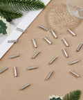 60Pcs Bolo Tie Tips And Cap Buckles Set In Silver Tone, 21.5mm Long With 4mm Inner Diameter, Alloy Bolo Findings For DIY Jewelry Making, Garment Decoration And Craft Projects, Platinum Finish, silver alloy tips on craft surface