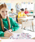 Child in classroom using 180 Piece Motivational Erasers Bulk For Kids And Classroom Use with Six Uplifting Designs.