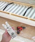 Hand holding Heavy Duty Sectional Couch Connectors with screws for modular sofas interlocking metal clips next to a power drill