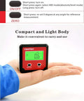 Digital Angle Gauge DAG V1 with backlit display in hand showing 0.6 degree on green backlight, compact pro-grade tool