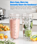 Ninja Blender Replacement Parts Kit With Two 24 Oz Cups And To Go Lids, filled with smoothie and water, on kitchen counter