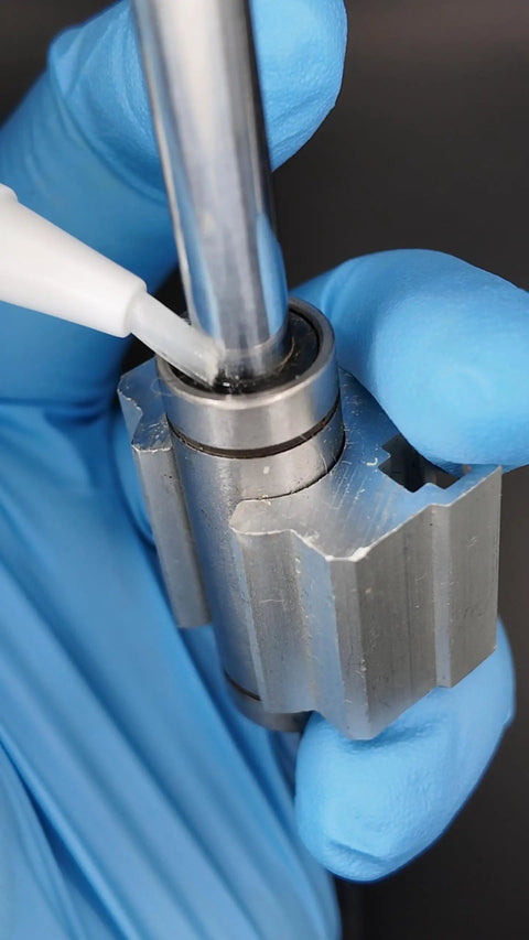 Twist To Dispense Precision Oil Applicator With Food Grade Synthetic Lubricant For 3D Printers CNC Laser Engravers Sewing Machines Keeps Bearings Rails And Motion Systems Running Smoothly lubricating metal bearing close-up
