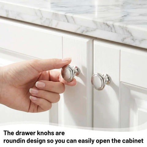 Hand holding 30 Pack Stainless Steel Cabinet Knobs 1.18 Inch Round Brushed Silver Drawer Pulls with Screws on white cupboard