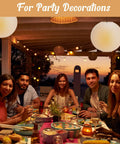 Jumbo 30 Inch White Paper Lanterns Hanging Luminaries For Weddings And Events lighting up an evening outdoor dinner party.